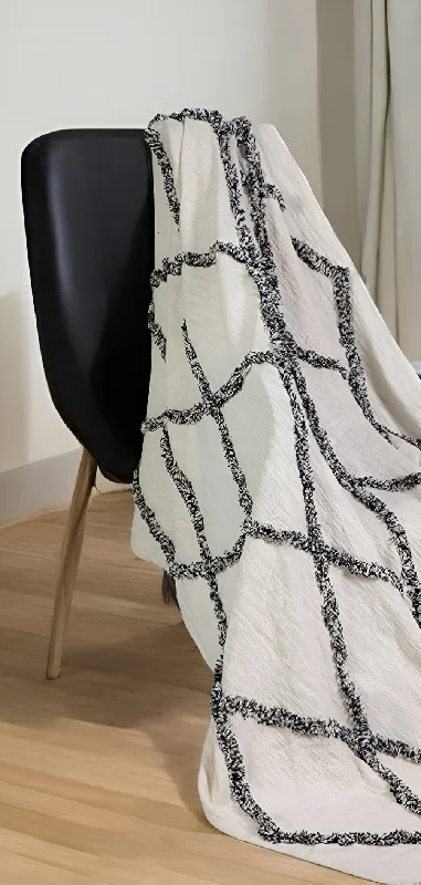 Microfiber blankets that are durable and easy to care for60" X 50" Cream Woven Cotton Geometric Throw Blanket with Fringe